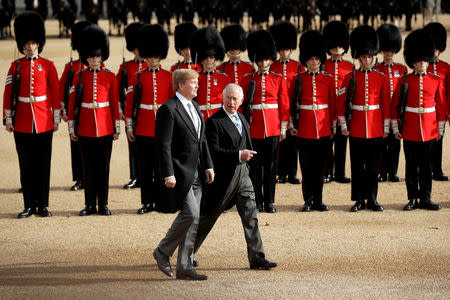 King Willem-Alexander of the Netherlands and Briain's Prince Charles, review the Honour Guard during a ceremonial welcome at the start of a state visit by King Willem-Alexander and Queen Maxima of the Netherlands at Horse Guards Parade, in London, Britain October 23, 2018. Matt Dunham/Pool via REUTERS