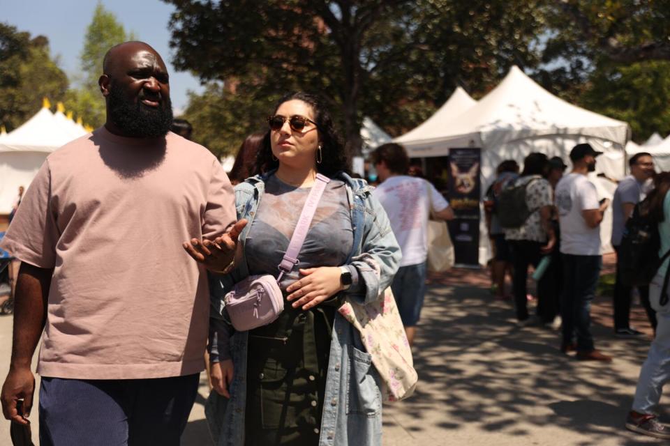 Couple Julian Obubo and Ani Kelemdjian roam during the LA Times Book Festival.