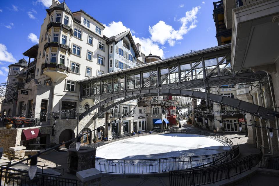 This Tuesday, March 24, 2020 photo shows an empty ice skating rink at the base in Vail, Colo., after Vail Ski Resort closed for the season amid the COVID-19 pandemic. Ski resorts across the West that were shut down amid coronavirus fears are grappling with an economic blow at a time they would normally be welcoming hordes of spring break revelers. (AP Photo/Michael Ciaglo)