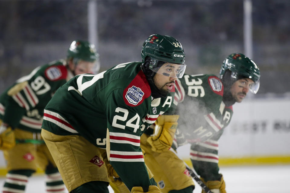 FILE - Minnesota Wild defenseman Matt Dumba (24), Wild right wing Mats Zuccarello (36) and Wild left wing Kirill Kaprizov (97) wait for a face off during the NHL Winter Classic hockey game Saturday, Jan. 1, 2022, at Target Field in Minneapolis. For too long, Matt Dumba felt he was on his own dealing with racial taunts directed at him as a youngster growing up in Saskatchewan. It was no different for Dumba as an adult, one of just a handful of minority players in the National Hockey League.(AP Photo/Andy Clayton-King, File)