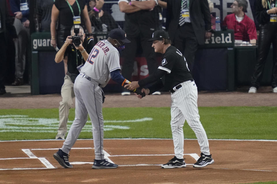 Houston Astros manager Dusty Baker Jr., left, and Chicago White Sox manager Tony La Russa greet each other before Game 3 of a baseball American League Division Series, Sunday, Oct. 10, 2021, in Chicago. (AP Photo/Charles Rex Arbogast)