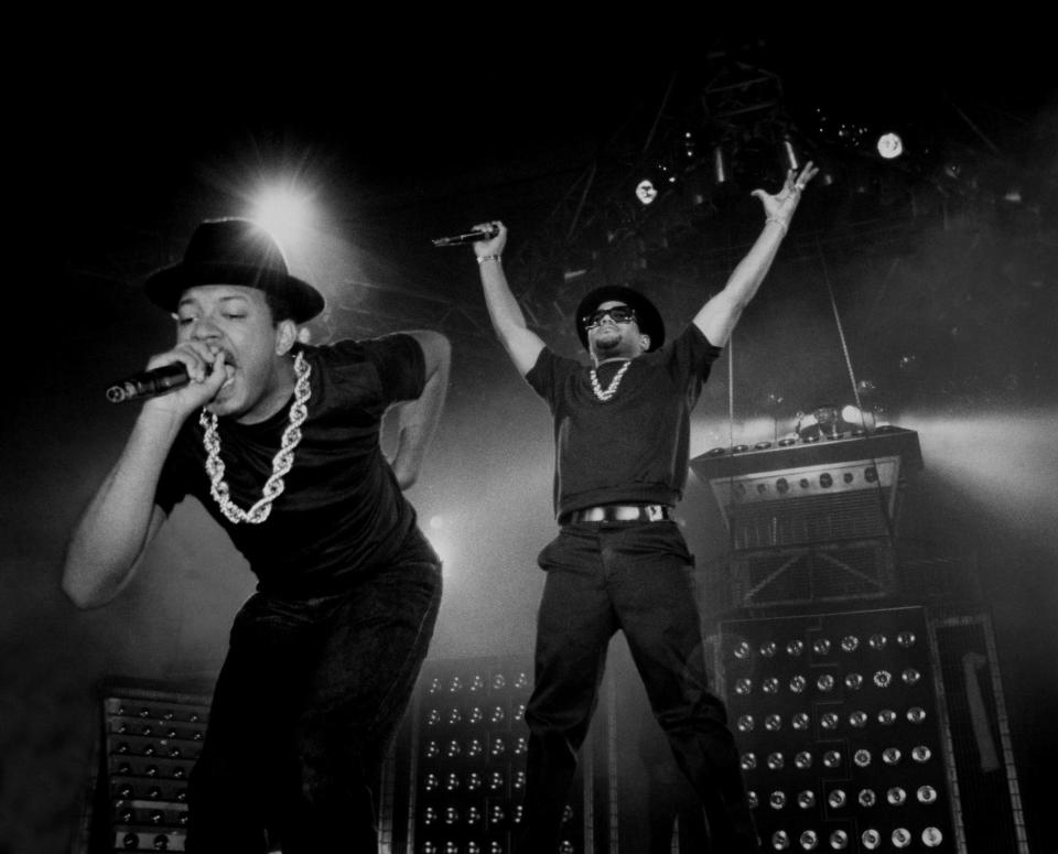 Rappers Run (Joseph Simmons) and DMC (Darryl McDaniels) of Run DMC performs at the U.I.C. Pavilion in Chicago, Illinois in 1984.