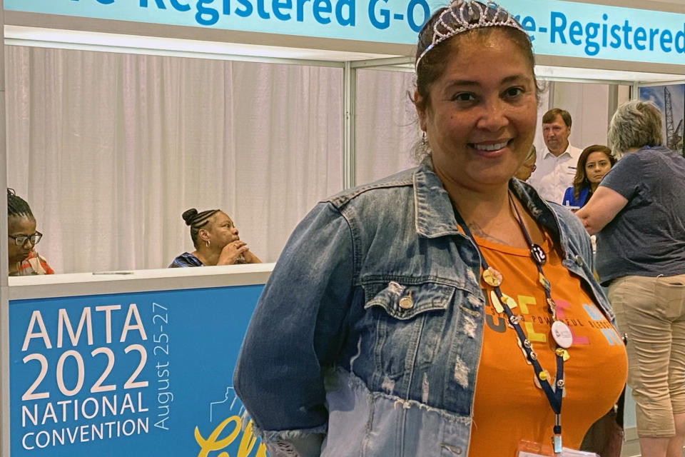 Marcella Thompson, of Louisville, Ky., poses at the American Massage Therapist Association national convention at the Huntington Convention Center in Cleveland, Ohio, Wednesday, Aug. 24, 2022. Professionals attending the American Massage Therapy Association national convention have gathered to talk about their work. It's a job that can be difficult and the pandemic, tragic murders in Georgia and the lingering stain of NFL quarterback Deshaun Watson's ongoing case have perpetuated the sex worker stigma around the industry. “We have to be less intimidated," Thompson said, “and be more stern and make sure those boundaries are completely clear." (AP Photo/Teresa Walker)