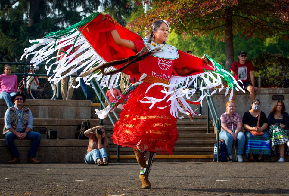 Keyen Singer dances in traditional attire during a ceremony at the ERB Memorial Union building on University of Oregon campus to mark Indigenous Peoples' Day.