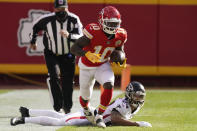 Kansas City Chiefs wide receiver Tyreek Hill runs down the sideline after evading a tackle by Atlanta Falcons A.J. Terrell during an NFL football game, Sunday, Dec. 27, 2020, in Kansas City. (AP Photo/Charlie Riedel)