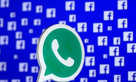 A 3D printed Whatsapp logo is seen in front of a displayed stock graph in this illustration taken April 28, 2016. REUTERS/Dado Ruvic/Illustration