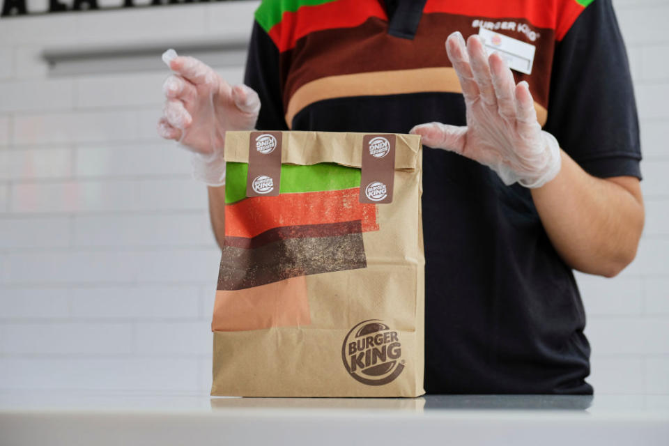 A Burger King employee packages up an order.