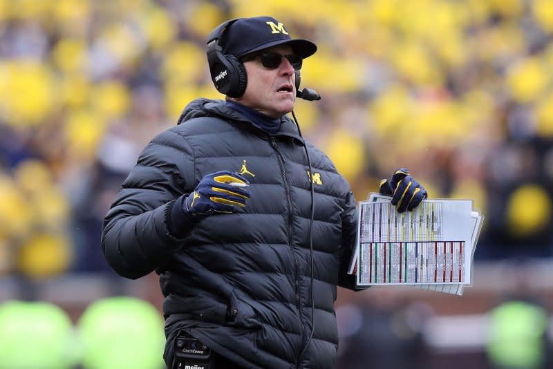 Coach Jim Harbaugh and the Michigan Wolverines went 13-0 this season. File Photo by Aaron Josefczyk/UPI