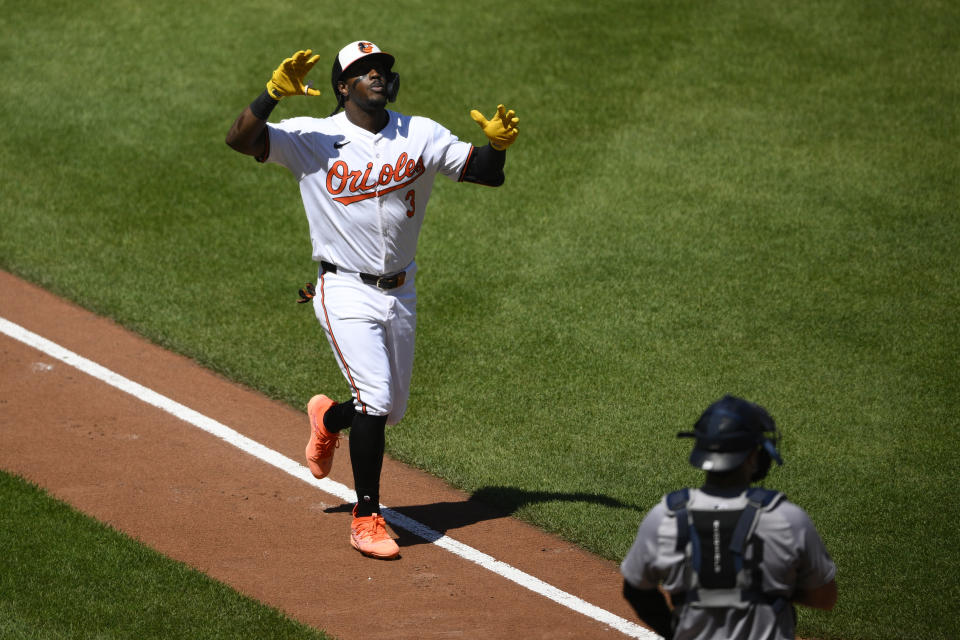 Baltimore Orioles' Jorge Mateo, left, celebrates his home run during the fourth inning of a baseball game as New York Yankees catcher Austin Wells looks on at lower right, Thursday, May 2, 2024, in Baltimore. (AP Photo/Nick Wass)