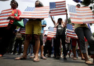 Protesters display placards during a rally at the U.S. Embassy against a visit of U.S. President Barack Obama Wednesday, April 23, 2014 in Manila, Philippines. Obama arrives in Manila on Monday for an overnight stop after visiting Japan, South Korea and Malaysia. (AP Photo/Bullit Marquez)