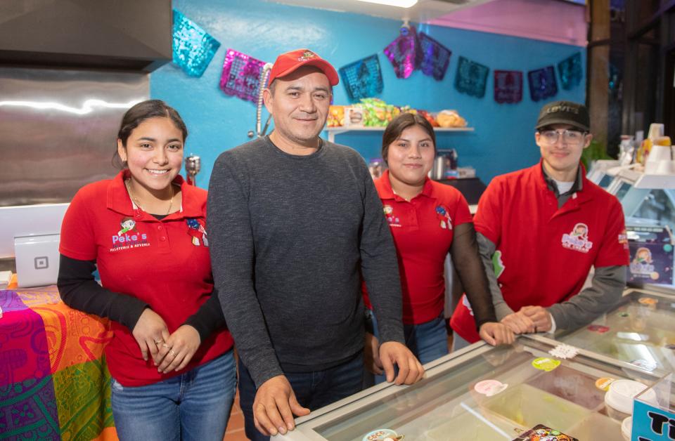 Owner Ricardo De La Cruz, center, with his daughter Andrea De La Cruz, left, and employees Ana Lucero and Brandon Mora at Peke's Ice Cream Paleteria & Neveria in the Waterfront Warehouse in downtown Stockton on Friday, Mar. 17, 2023.