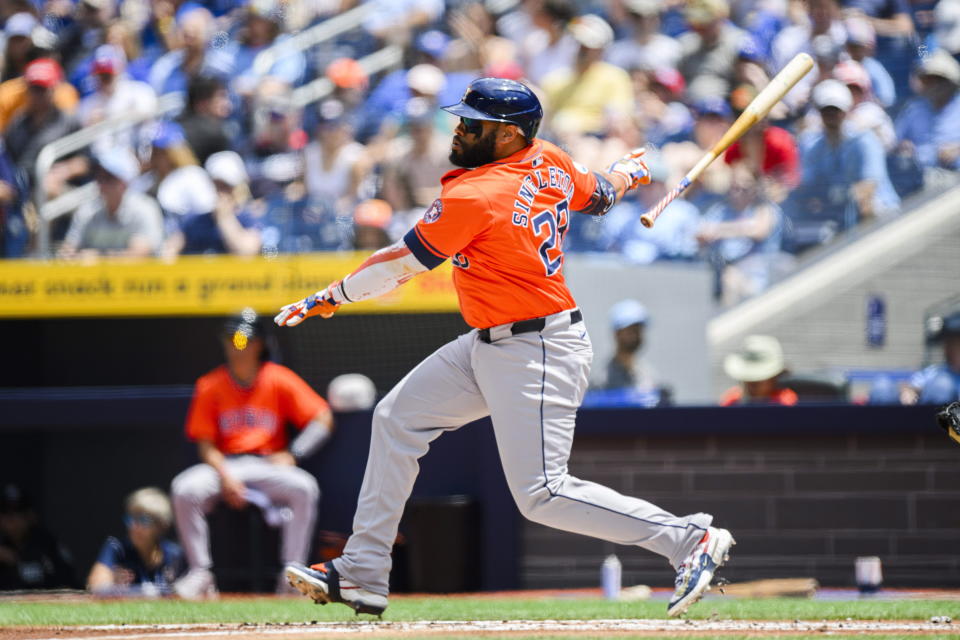 Houston Astros first base Jon Singleton (28) hits a line drive single during the first inning of a baseball game against the Toronto Blue Jays, in Toronto on Thursday, July 4, 2024. (Christopher Katsarov/The Canadian Press via AP)