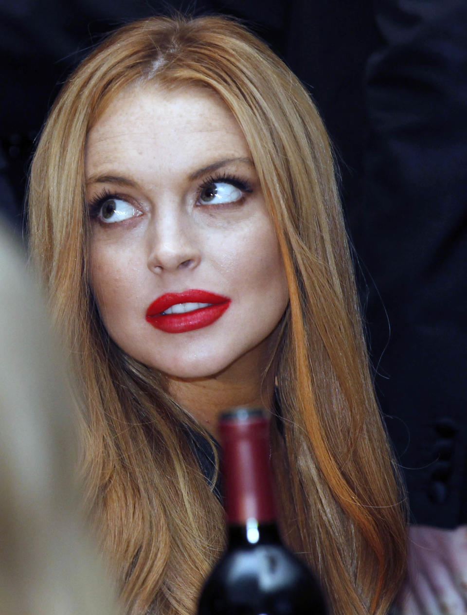 Lindsay Lohan attends the White House Correspondents' Association Dinner headlined by late-night comic Jimmy Kimmel, Saturday, April 28, 2012 in Washington. (AP Photo/Haraz N. Ghanbari)