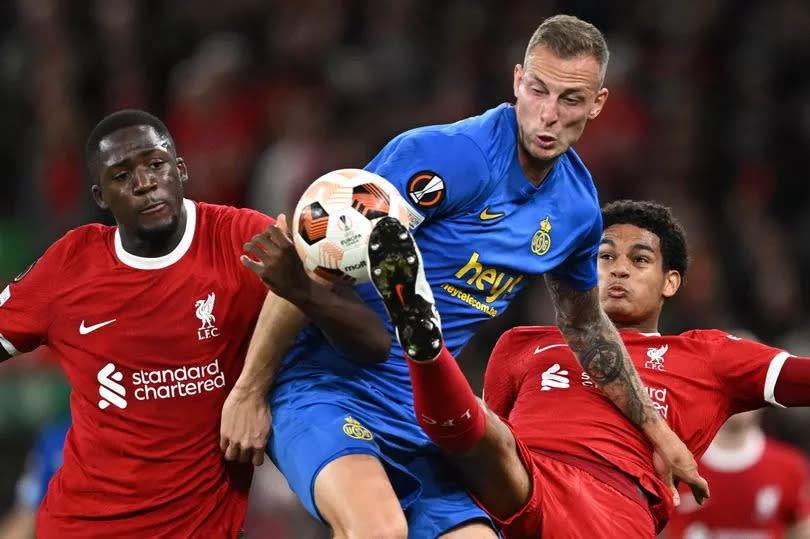 Liverpool defenders Ibrahima Konate (left) and Jarell Quansah challenge with Union Saint-Gilloise striker Gustaf Nilsson during the Europa League group match at Anfield on October 5 2023