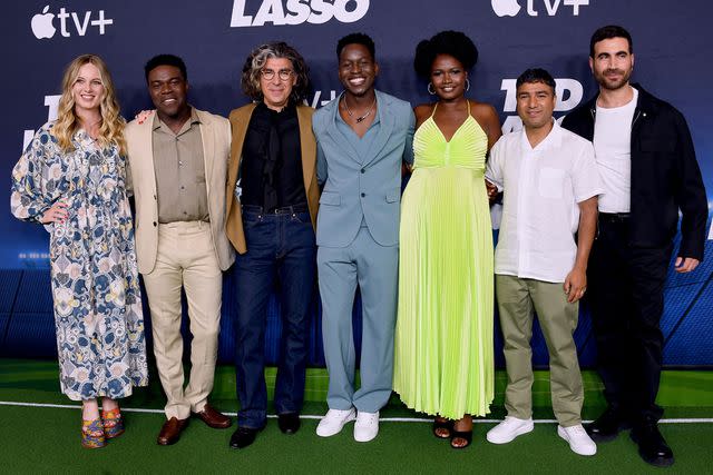 <p>Jon Kopaloff/Getty</p> Sam Richardson poses with some of his 'Ted Lasso' castmates