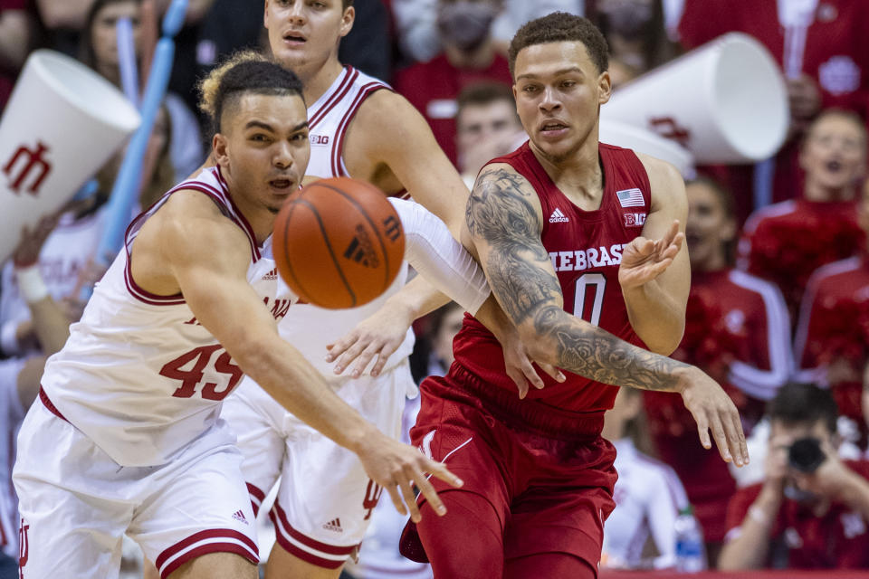 Indiana guard Parker Stewart (45) deflects a pass by Nebraska guard C.J. Wilcher (0) during the second half of a NCAA college basketball game, Saturday, Dec. 4, 2021, in Bloomington, Ind. (AP Photo/Doug McSchooler)