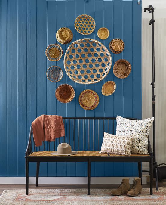 <p>A bevy of baskets brings ample texture to a room. Using nails, hang a larger basket in the middle, then surround with smaller baskets in a circular or starburst pattern.</p>