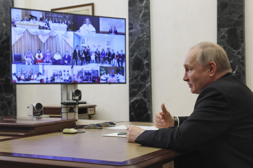 Russian President Vladimir Putin attends a meeting with families awarded Orders of Parental Glory via teleconference call at the Kremlin in Moscow, Russia, Thursday, June 1, 2023. (Gavriil Grigorov, Sputnik, Kremlin Pool Photo via AP)