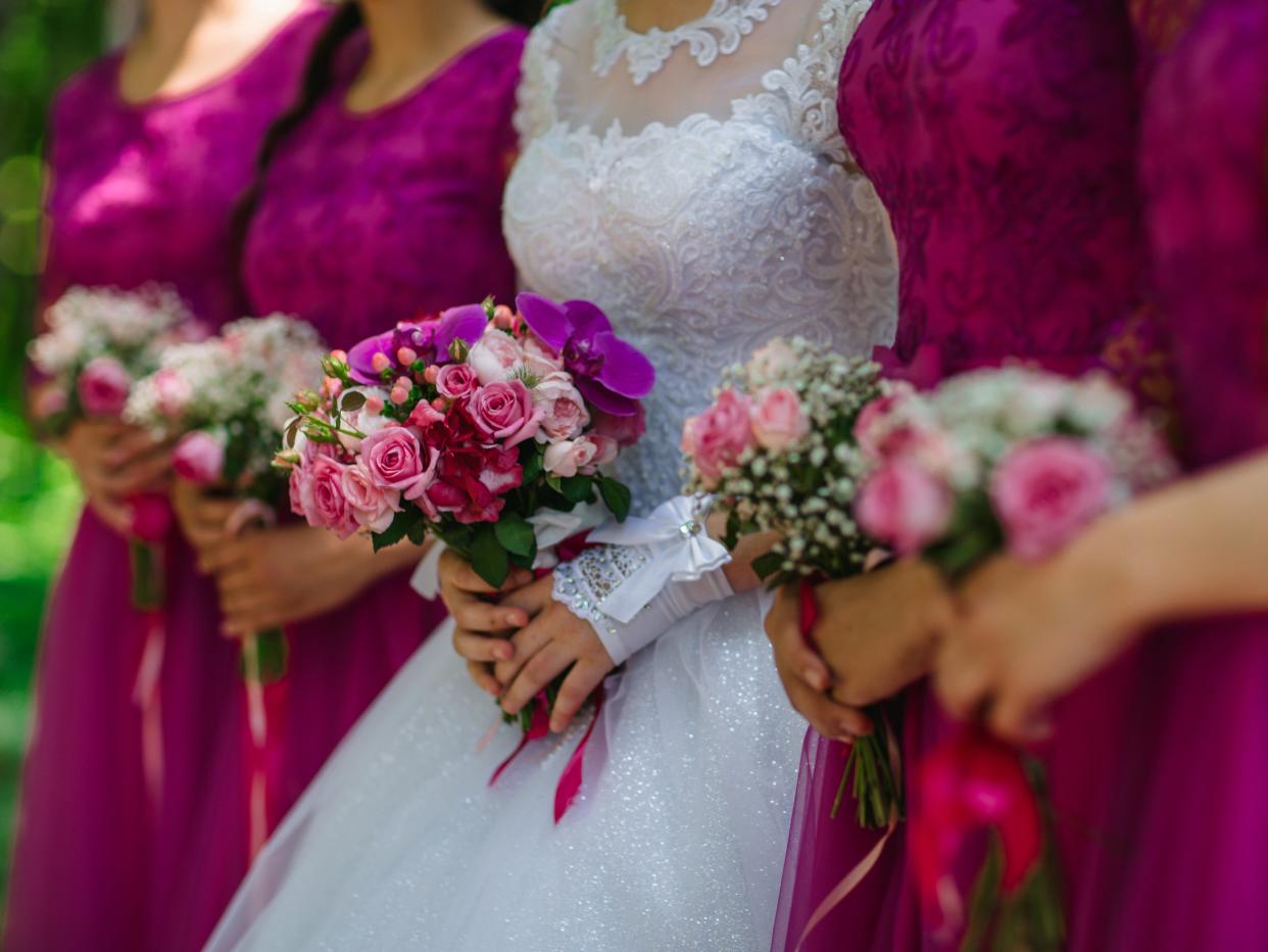 bride holds in her hands her wedding bouquet of fresh flowers