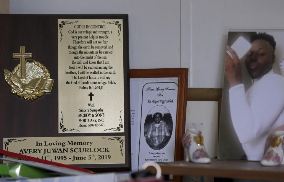 In this photo taken Tuesday, Aug. 6, 2019 a plaque honoring Brenda Scurlock's son Avery sits in Scurlock's home in Lumber Bridge, N.C. Scurlock's son, who used the name Chanel when dressing as a woman in social settings and hoped to have sex reassignment surgery, was found shot to death in June. This death of a transgender person in North Carolina is one of 18 so far this year, and 17 of the victims have been black women. (AP Photo/Gerry Broome)