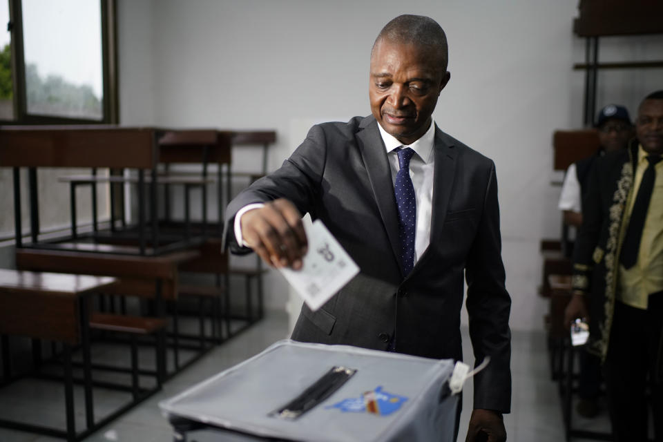 Ruling party presidential candidate Emmanuel Ramazani Shadary casts his vote Sunday, Dec. 30, 2018 in Kinshasa, Congo. Forty million voters are registered for a presidential race plagued by years of delay and persistent rumors of lack of preparation. (AP Photo/Jerome Delay)