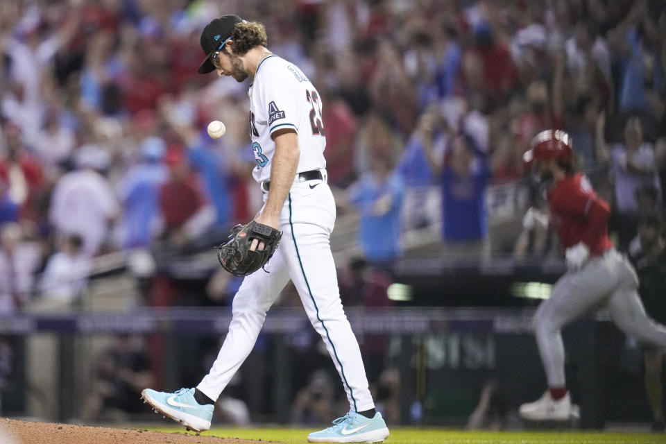 Philadelphia Phillies' Bryce Harper rounds the bases after a home run off Arizona Diamondbacks starting pitcher Zac Gallen during the sixth inning in Game 5 of the baseball NL Championship Series in Phoenix, Saturday, Oct. 21, 2023. (AP Photo/Ross D. Franklin)