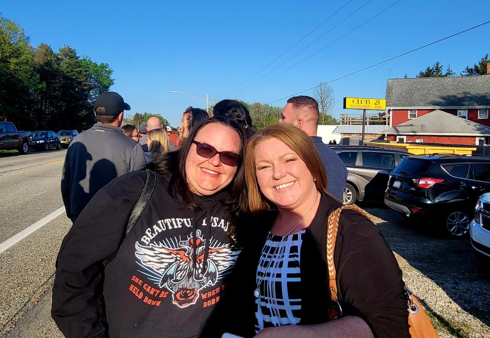 Jessica Hord, of Emmett, and Tina Bowen, of Capac, await in line on Wednesday, May 8, 2024, outside Club 21 in Goodells. Like others, they saw a promotional flyer on Facebook about a realty show, 