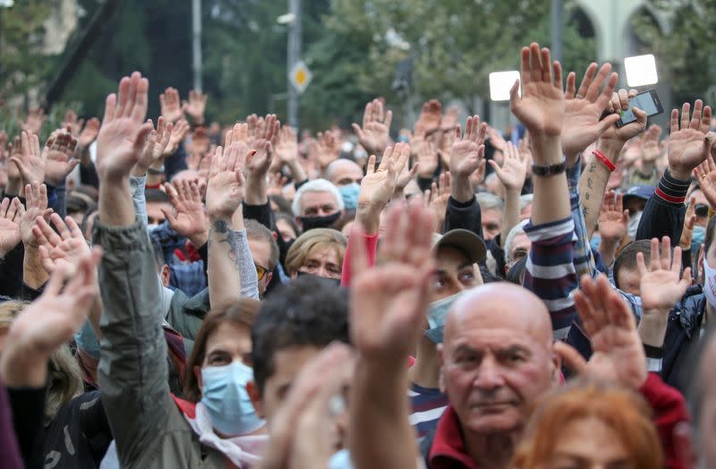 Opposition supporters attend a rally following the announcement of parliamentary election preliminary results