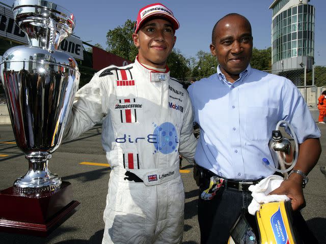 <p>Mark Thompson/Getty </p> Lewis Hamilton celebrates winning the GP2 championship with his father Anthony Hamilton at the Autodromo di Monza on September 10, 2006 in Monza, Italy.