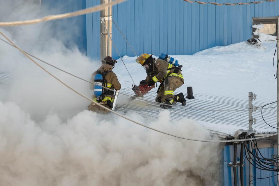 Firefighters respond to a fire at Building 157 in Iqaluit on Tuesday, March 26, 2024. 