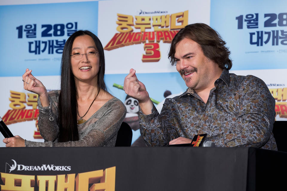"Kung Fu Panda 3" director Jennifer Yuh&nbsp;shows&nbsp;actor Jack Black how to form a proper finger heart at a 2016 press event.