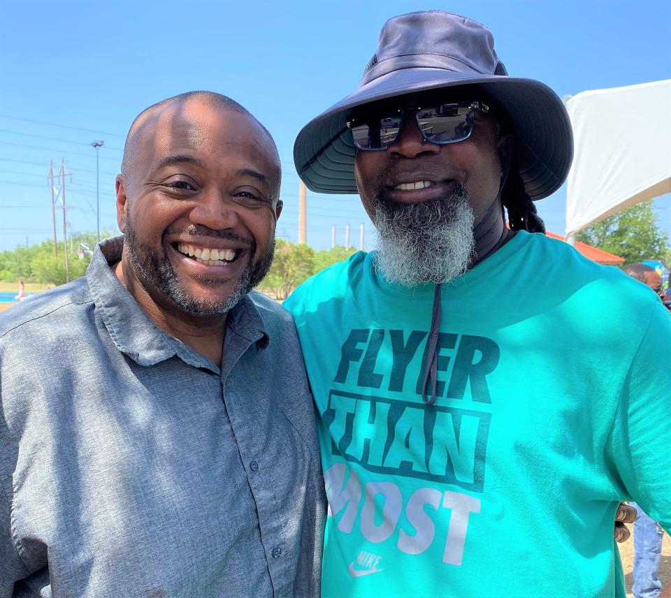 Mayor Anthony Williams, left and his Abilene High classmate Bobby Walker caught up at last weekend's Juneteenth celebration at Stevenson Park.