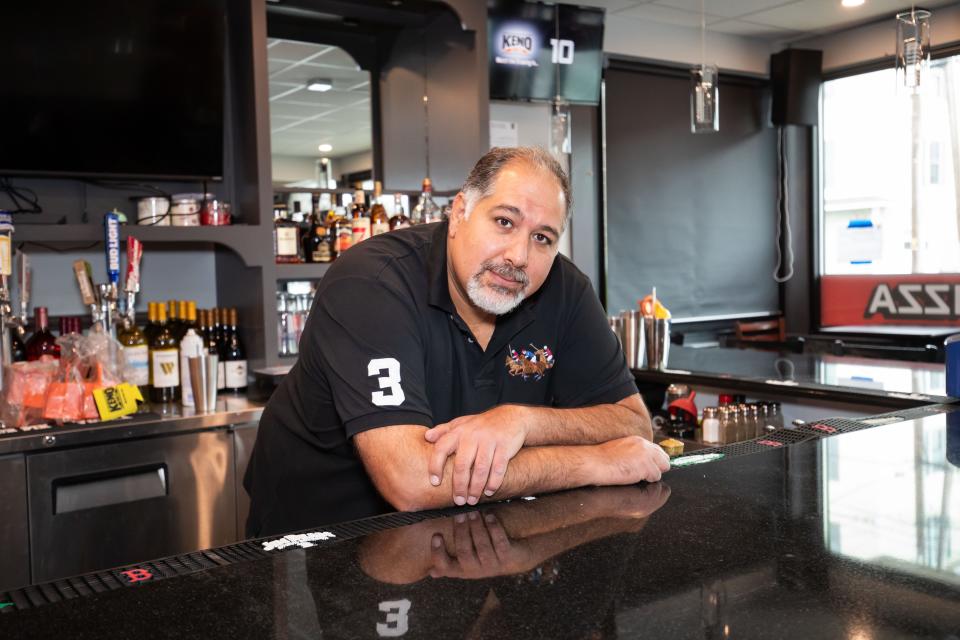 Greg's Bistro owner Hakim Said prepares for the reopening of his restaurant bar after extensive plumbing repairs were made over the past five months.