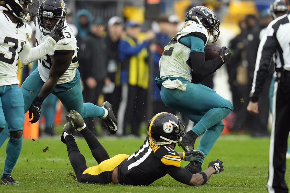 Jacksonville Jaguars safety Andrew Wingard (42) intercepts a pass intended for Pittsburgh Steelers wide receiver Allen Robinson II (11) during the second half of an NFL football game Sunday, Oct. 29, 2023, in Pittsburgh. (AP Photo/Gene J. Puskar)