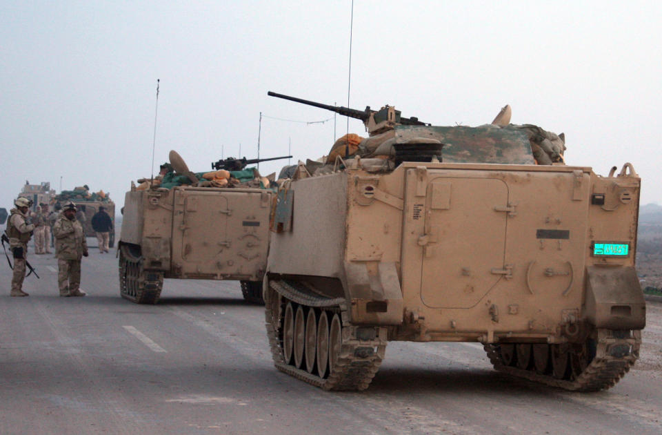 In this photo taken on Jan. 17, 2014, Iraqi army soldiers patrol in Ramadi, Iraq, 70 miles (115 kilometers) west of Baghdad, Iraq. Islamic militants controlling a mainly Sunni area west of Baghdad are so well-armed that they could occupy the capital, a top Iraqi official warned Monday, a frank and bleak assessment of the challenge posed in routing the insurgents as a new wave of bombings killed at least 31 people. Since late December, members of Iraq's al-Qaida branch - known as the Islamic State of Iraq and the Levant - have taken over parts of Ramadi, the capital of the largely Sunni western province of Anbar. They also control the center of the nearby city of Fallujah, along with other non-al-Qaida militants who also oppose the Shiite-led government. (AP Photo)