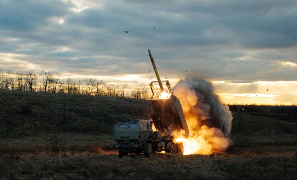 A rocket being launched from a HIMARS launcher.