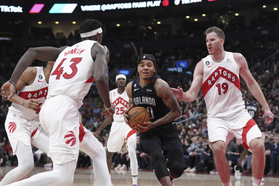 Orlando Magic's Markelle Fultz drives at the Toronto Raptors defense during the second half of an NBA basketball game in Toronto on Tuesday, Feb. 14, 2023. (Chris Young/The Canadian Press via AP)