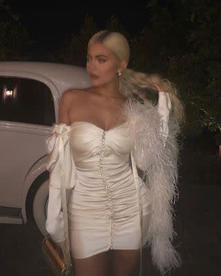 Kylie Jenner Shows Off Holiday Party Style in Leggy Feathered