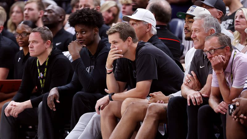 Jazz coach Will Hardy watches with other players, team officials and coaches as the Utah Jazz and Philadelphia 76ers play in Summer League action at the Delta Center in Salt Lake City on July 5, 2023.