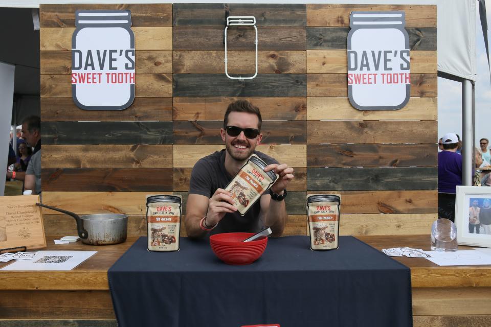 Dave's Sweet Tooth owner Andrew Chmielewski displays his vendor tent during the MI New Favorite Snack competition at Vantage Point in Port Huron on Saturday, Sept. 17, 2022.