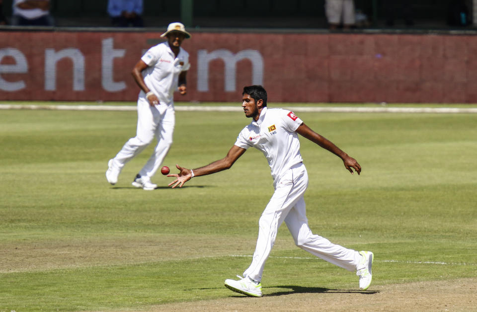 Sri Lanka's bowler Kasun Rajitha fields off own bowling on day one of the second cricket test match between South Africa and Sri Lanka at St. George's Park in Port Elizabeth, South Africa, Thursday Feb. 21, 2019. (AP Photo/Michael Sheehan)