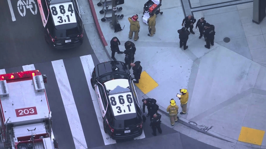 Two people are detained after reports of a man with a knife on top of a train in downtown Los Angeles.