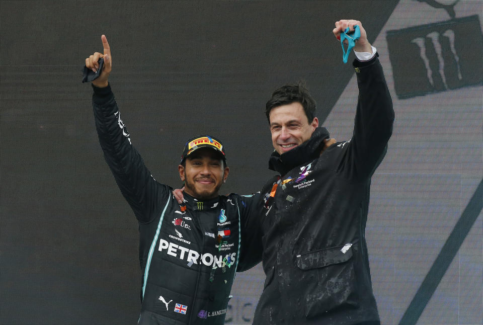 FILE - Mercedes driver Lewis Hamilton of Britain and Mercedes team principal Toto Wolff, right, celebrate after Hamilton won the race and his seventh world championship at the Formula One Turkish Grand Prix at the Istanbul Park circuit racetrack in Istanbul, Sunday, Nov. 15, 2020. Lewis Hamilton’s decision to leave Mercedes for Ferrari shocked the Formula One world with even Mercedes team principal Toto Wolff calling it a “surprise.” Wolff said he had heard rumors that Hamilton might leave but didn’t know for sure until the F1 great confirmed it over breakfast on Wednesday, Jan. 31, 2024 at Wolff’s home in Oxford, England. (AP Photo/Kenan Asyali, Pool, File)