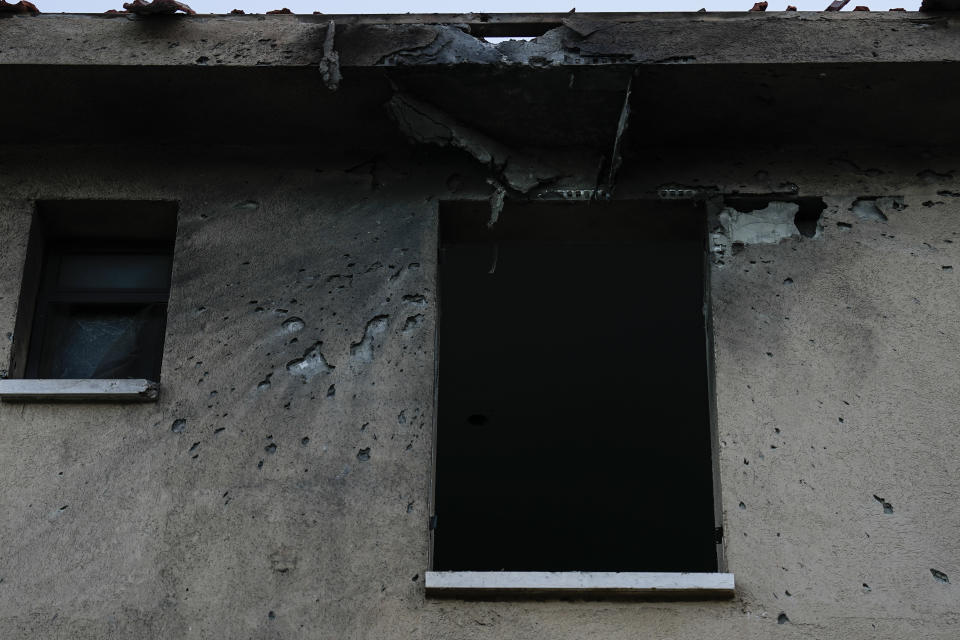 A damage to a house after a rocket fired by Lebanon's Hezbollah militant group hit the northern Israeli town of Kiryat Shmona, on the border with Lebanon, Tuesday, March 5, 2024. (AP Photo/Ariel Schalit)