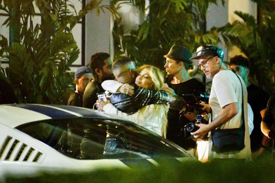 JLo hugs Rauw Alejandro as they shoot a video on location at Miami Beach’s Espanola War