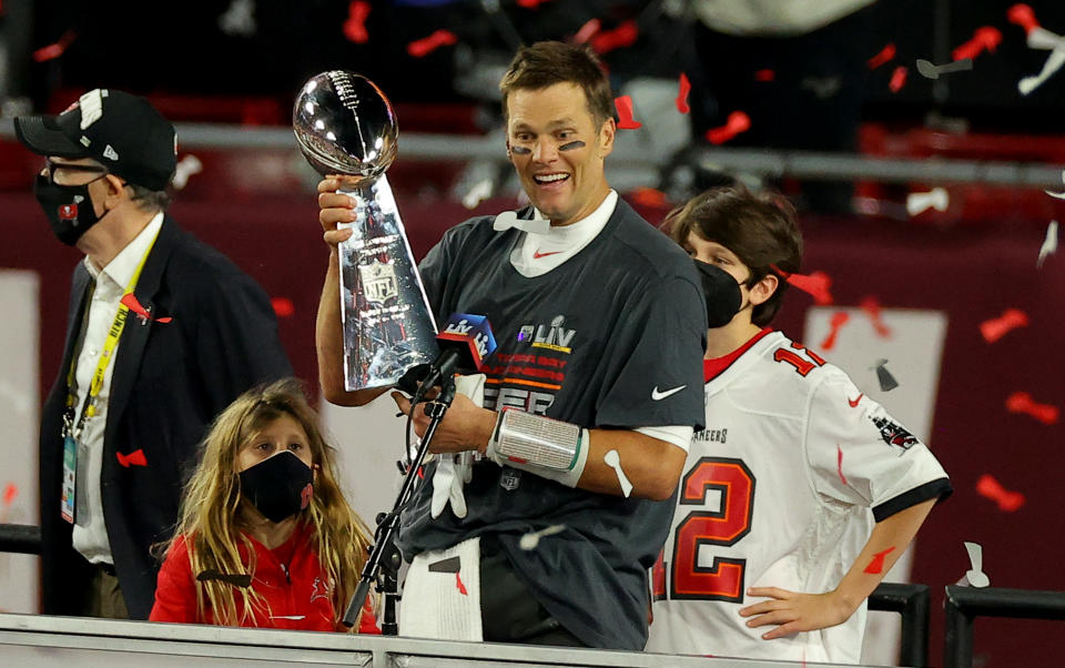 TAMPA, FLORIDA - FEBRUARY 07: Tom Brady #12 of the Tampa Bay Buccaneers hoists the Vince Lombardi trophy after winning Super Bowl LV at Raymond James Stadium on February 07, 2021 in Tampa, Florida. (Photo by Kevin C. Cox/Getty Images)