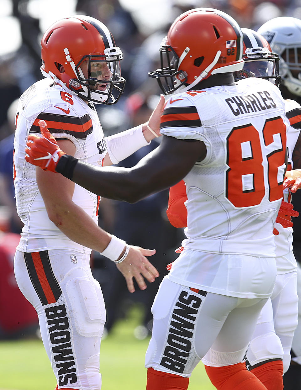 Cleveland Browns quarterback Baker Mayfield, left, celebrates with tight end Orson Charles (82) after Mayfield threw a touchdown pass to Darren Fells against the Oakland Raiders during the first half of an NFL football game in Oakland, Calif., Sunday, Sept. 30, 2018. (AP Photo/Ben Margot)