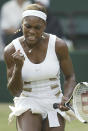 FILE - Defending champion Serena Williams punches the air on her way to defeating France's Amelie Mauresmo in their women's singles semifinal on the Centre Court at Wimbledon, Thursday July 1, 2004. The 2022 Wimbledon competition is not the first comeback from a significant absence for Williams. (AP Photo/Anja Niedringhaus, File)