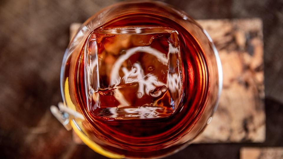 clear ice cube in cocktail drink