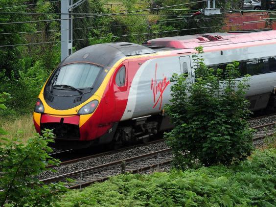 Trains currently take four hours from London to the Scottish central belt (PA)